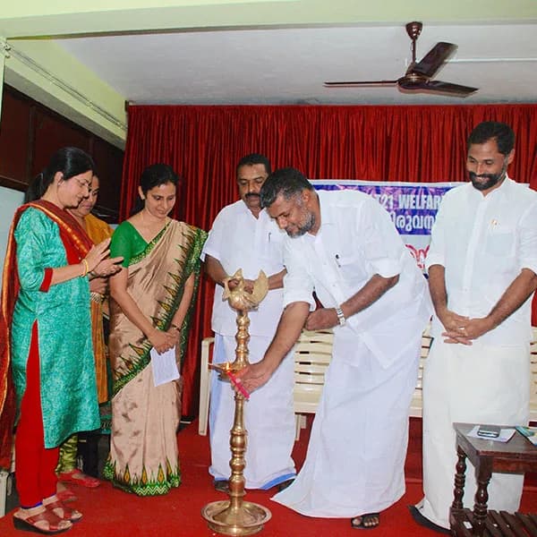 Guests light the ceremonial lamp to open the programme